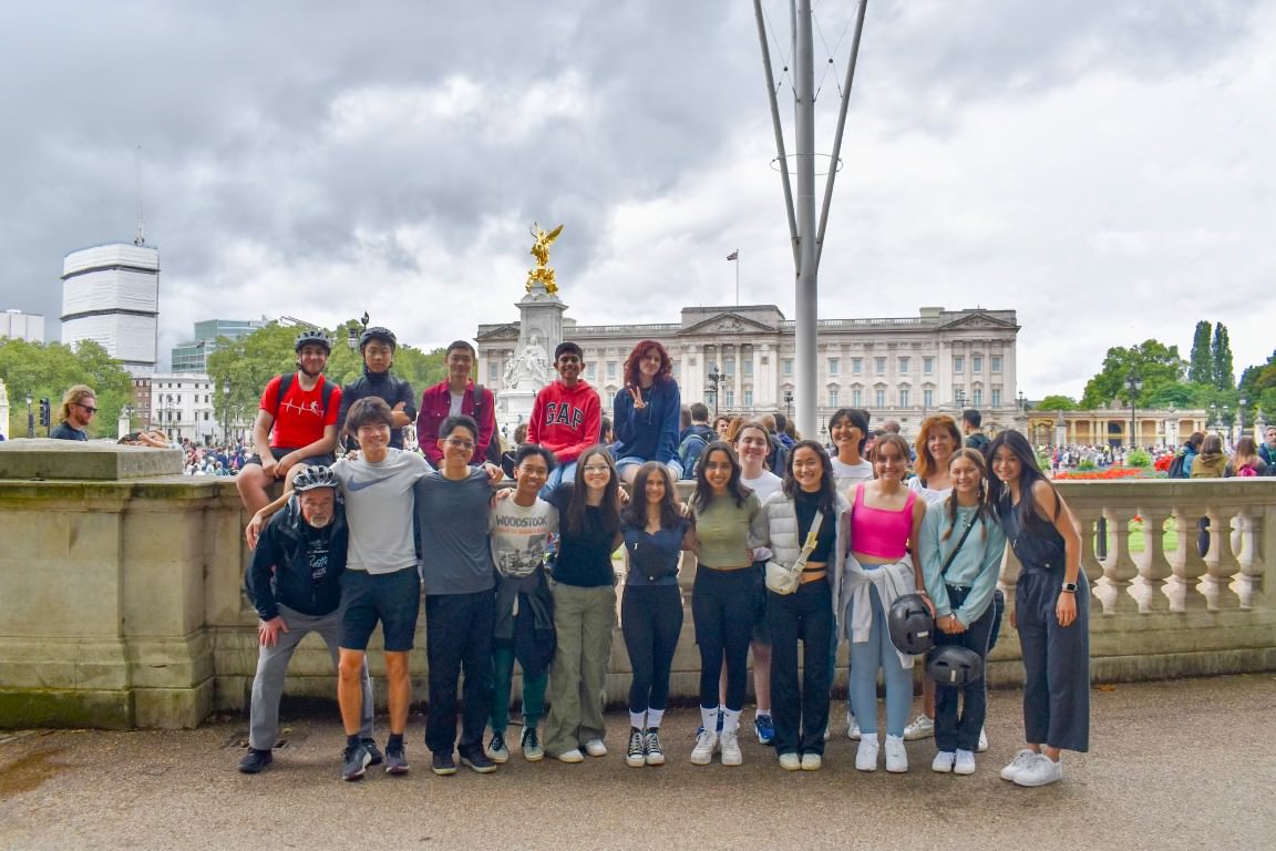 Both biking tour groups in front of Buckingham Palace.